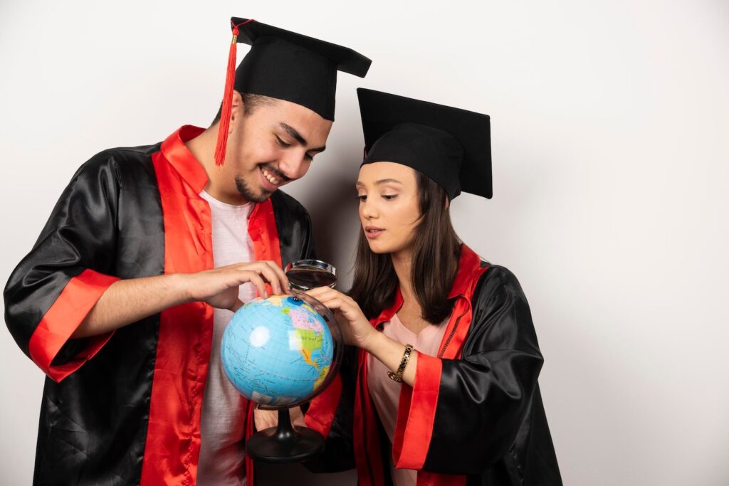 Education loan for abroad studies featuring graduates with a globe, symbolising international university admissions and overseas education funding.
