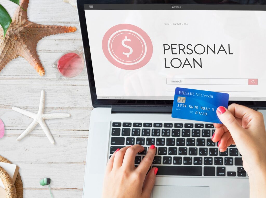 Personal loan eligibility online with laptop and credit card, showcasing instant loan application and digital financing solutions.